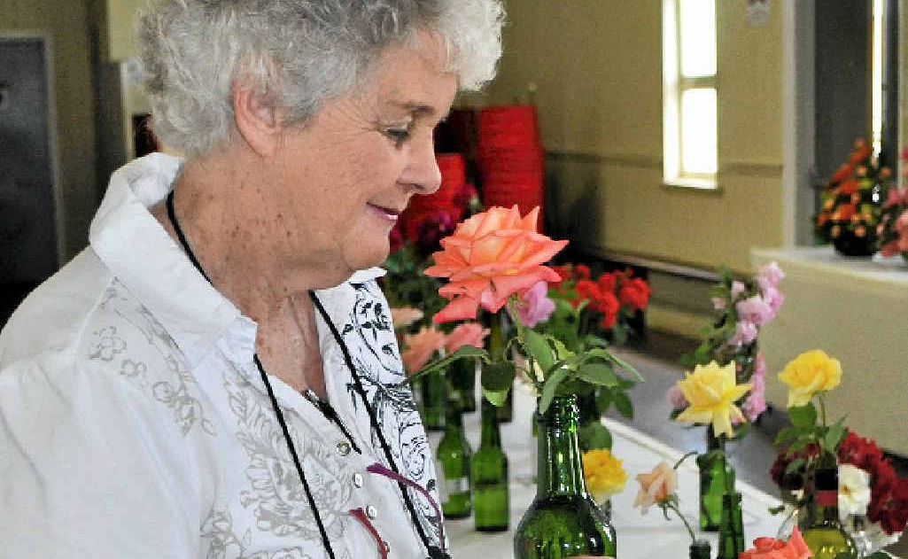 Dawn Gilliam enjoys the sweet smell of success after being awarded Champion Individual Rose at the Warwick Flower Show yesterday. Dawn Gilliam enjoys the sweet smell of success after being awarded Champion Individual Rose at the Warwick Flower Show yesterday.